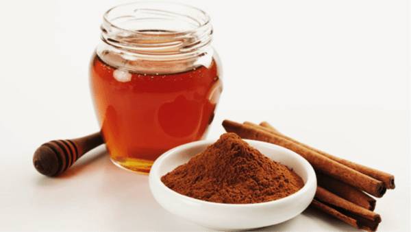 honey in a jar with honey powder