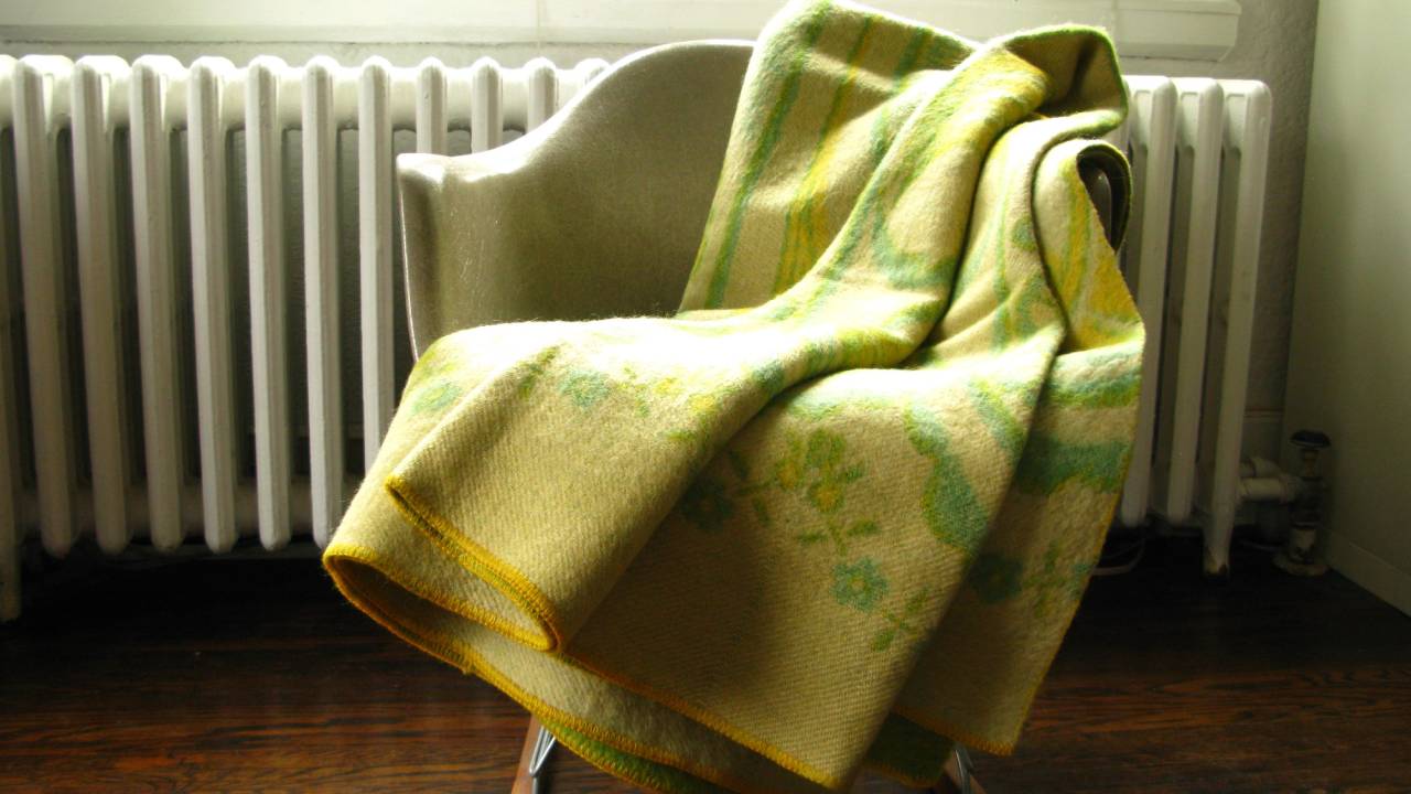 green and yellow blanket on a chair