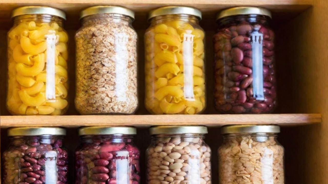 jars of dried food on shelves in closet